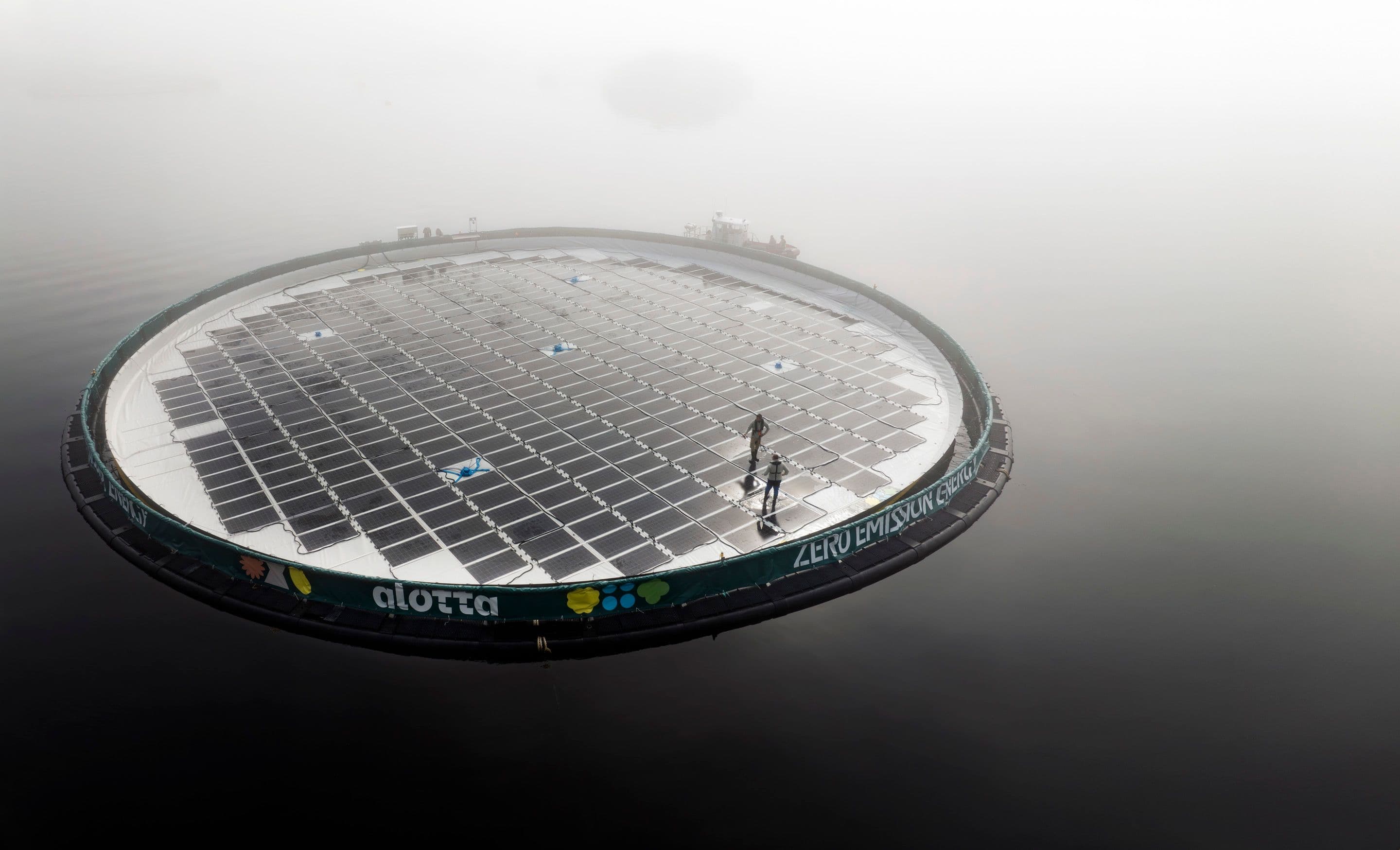 People standing on an Alotta Solar Hybrid Plant
