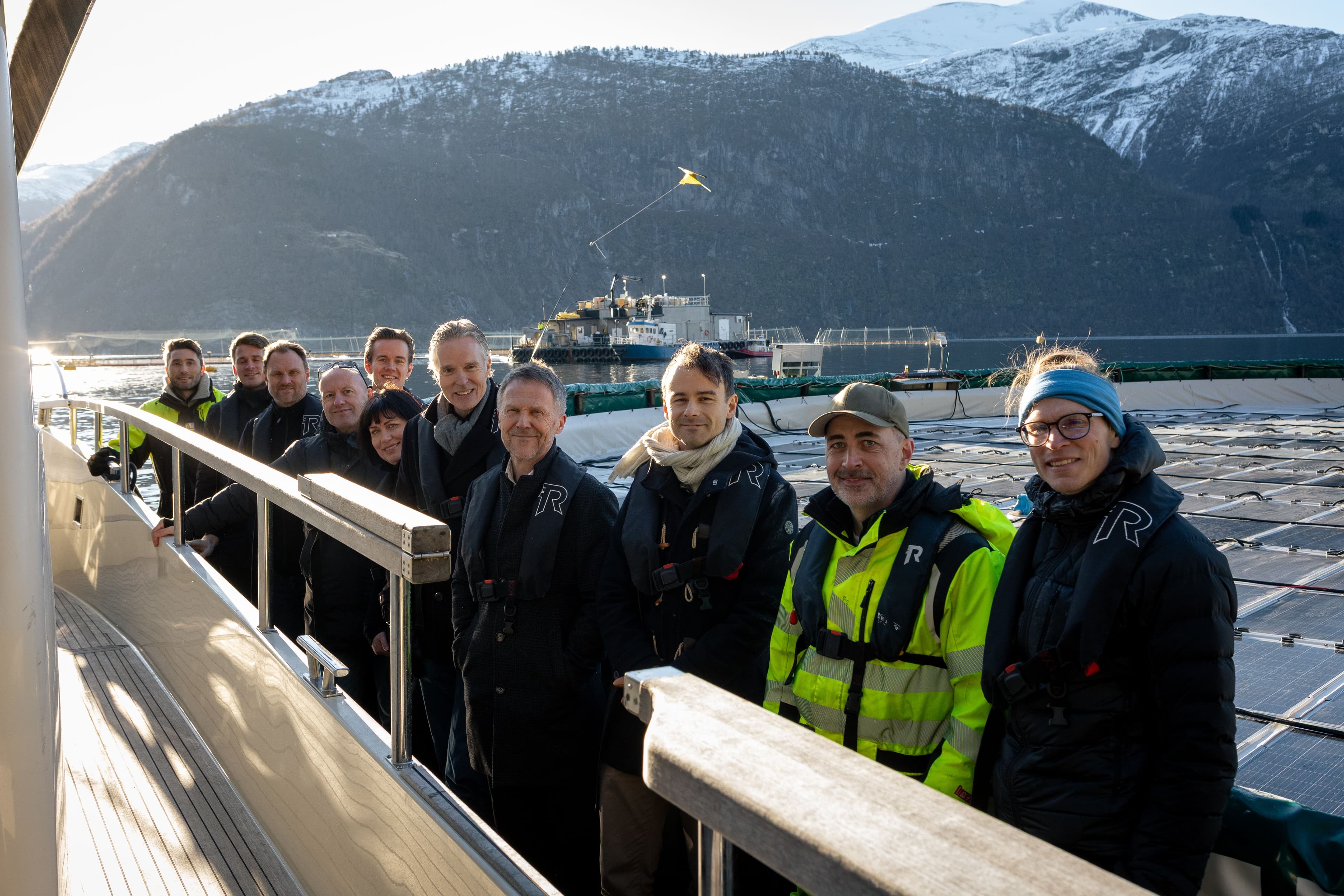 People standing on a floating solar power plant